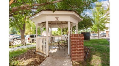 Outdoor gazebo surrounded by greenery
