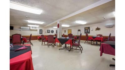 Dining room setup with tables and chairs