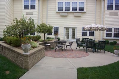 Outdoor seating area with tables and chairs