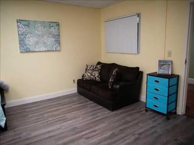 Cozy interior of a resident's room with couch and decor