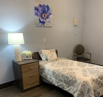 Cozy resident room with bed and decor