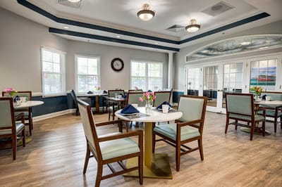 Bright dining room with floral decor and table settings
