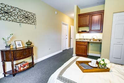 Brightly lit private room with decor and amenities