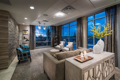 Cozy common area with comfortable seating and large windows