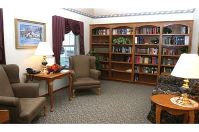 Cozy common area with bookshelves and seating