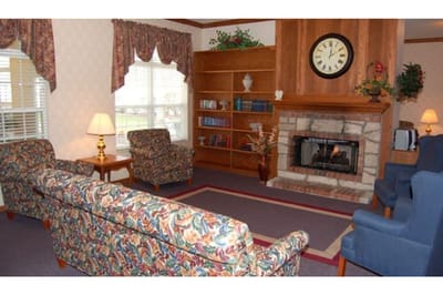 Cozy common area with a fireplace and seating