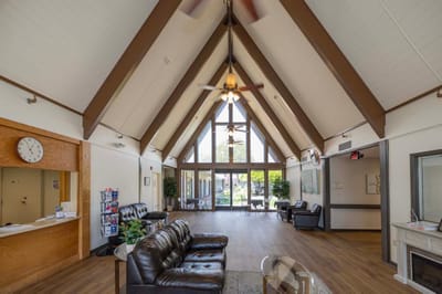 Spacious common area with seating and large windows