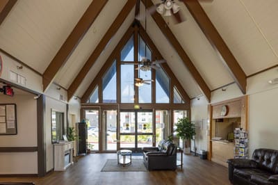 Spacious lobby with large windows and seating area