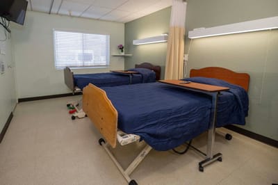 Shared resident room with two hospital beds