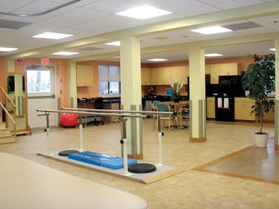 Interior rehabilitation space with exercise equipment.