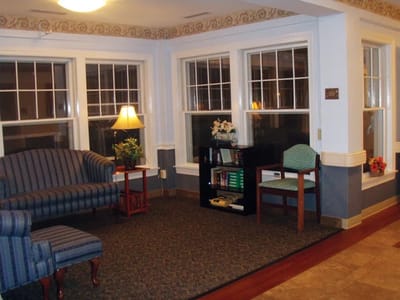 Cozy common area with seating and natural light.