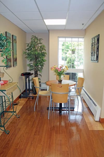 Common area with a table and plants