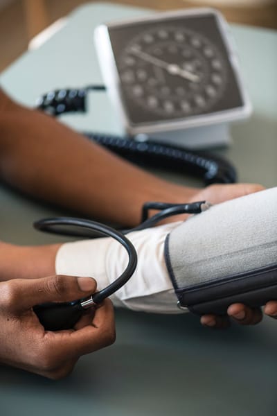 Nurse checking blood pressure of a resident