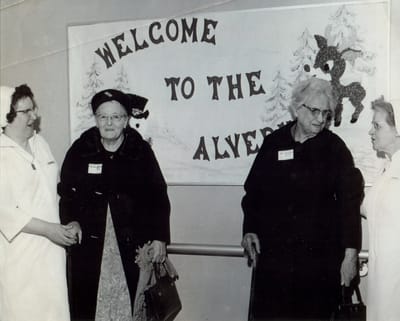 Residents and staff at a welcoming event.