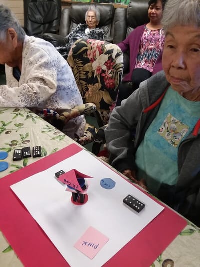Residents engaged in a game activity at the facility.
