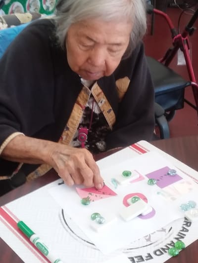 Resident engaging in a creative activity
