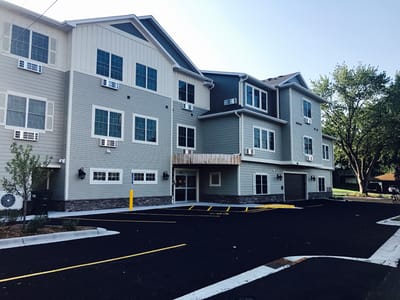 Exterior view of The Harbors Senior Living building