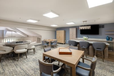 Bright, modern common area with seating and games