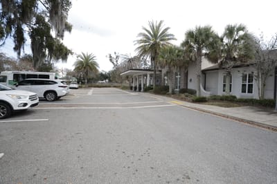 Exterior view of Ortega Gardens with palm trees