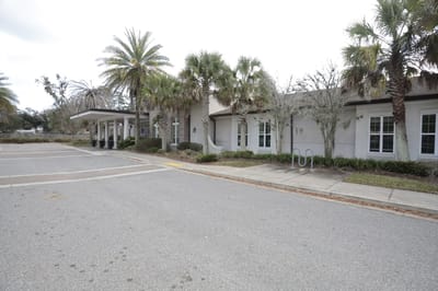 Exterior view of Ortega Gardens with palm trees
