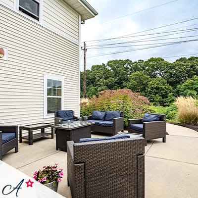 Outdoor seating area with comfortable furniture and garden