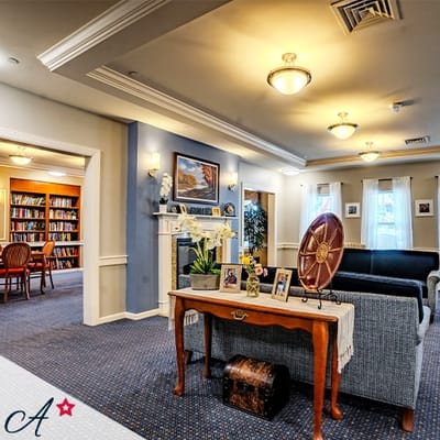 Welcoming common area with bookshelves and seating