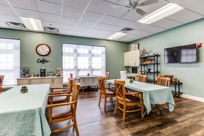 Bright common area with tables and chairs