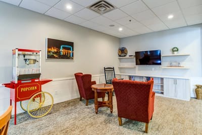 Cozy common area with popcorn machine and seating