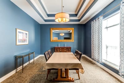 Brightly decorated common area with dining setup