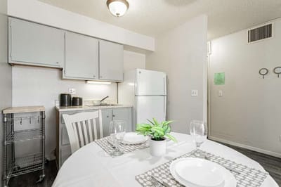 Bright kitchen area with dining table set for two