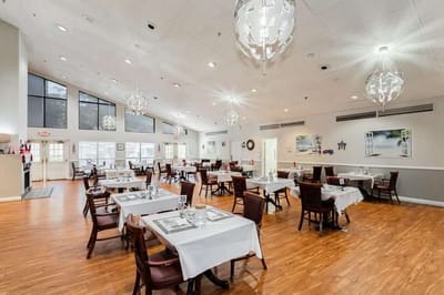 Dining area with elegant tables and light fixtures