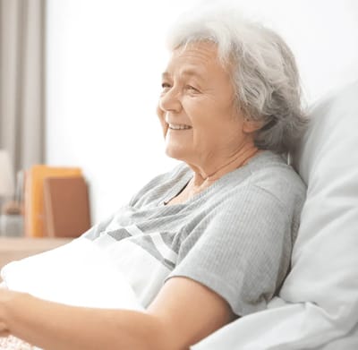 Senior woman smiling in a cozy room