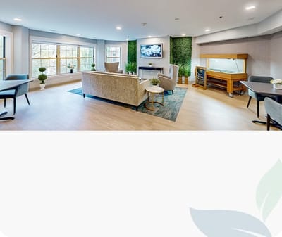 Bright common area with seating and a television