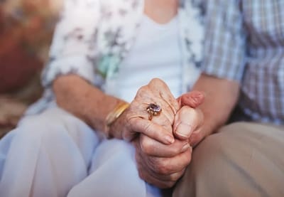 Two hands holding, symbolizing companionship