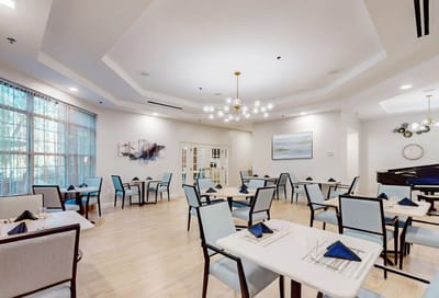 Bright dining area with tables set for meals