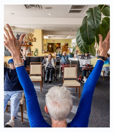 Residents participating in an engaging activity in a common area