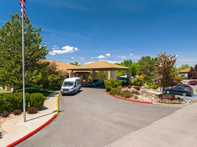 Entrance of a senior living facility with parking area