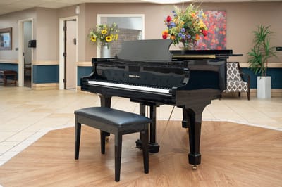 Elegant piano in a common area with floral decor