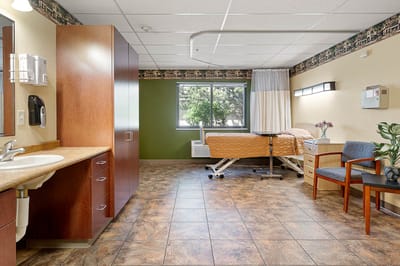Private resident room with bed and furnishings