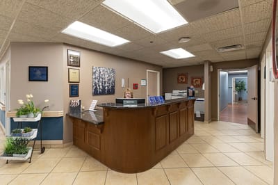 Reception area with staff member at the front desk