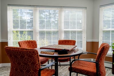 Bright activity room with seating and board games