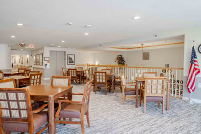 Bright dining area with wooden tables and chairs
