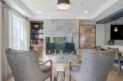 Interior common area with seating and a fireplace