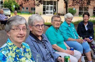 Residents enjoying drinks in an outdoor space