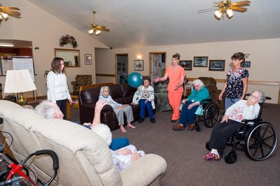 Residents and staff interacting in a common area