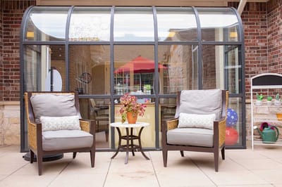 Outdoor seating area with plants and decor