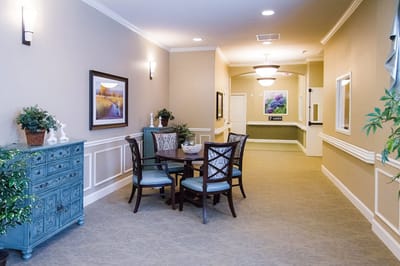 Interior hallway with seating area and artwork