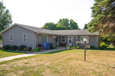 Exterior view of Tuff Memorial Home with garden space