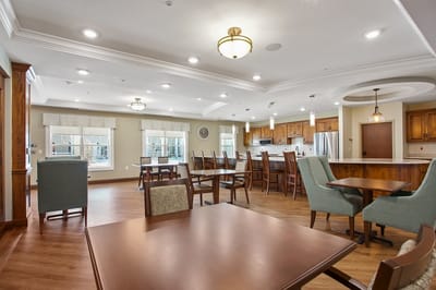 Interior view of a common area with dining tables and chairs