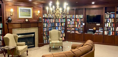 Cozy library corner with bookshelves and seating